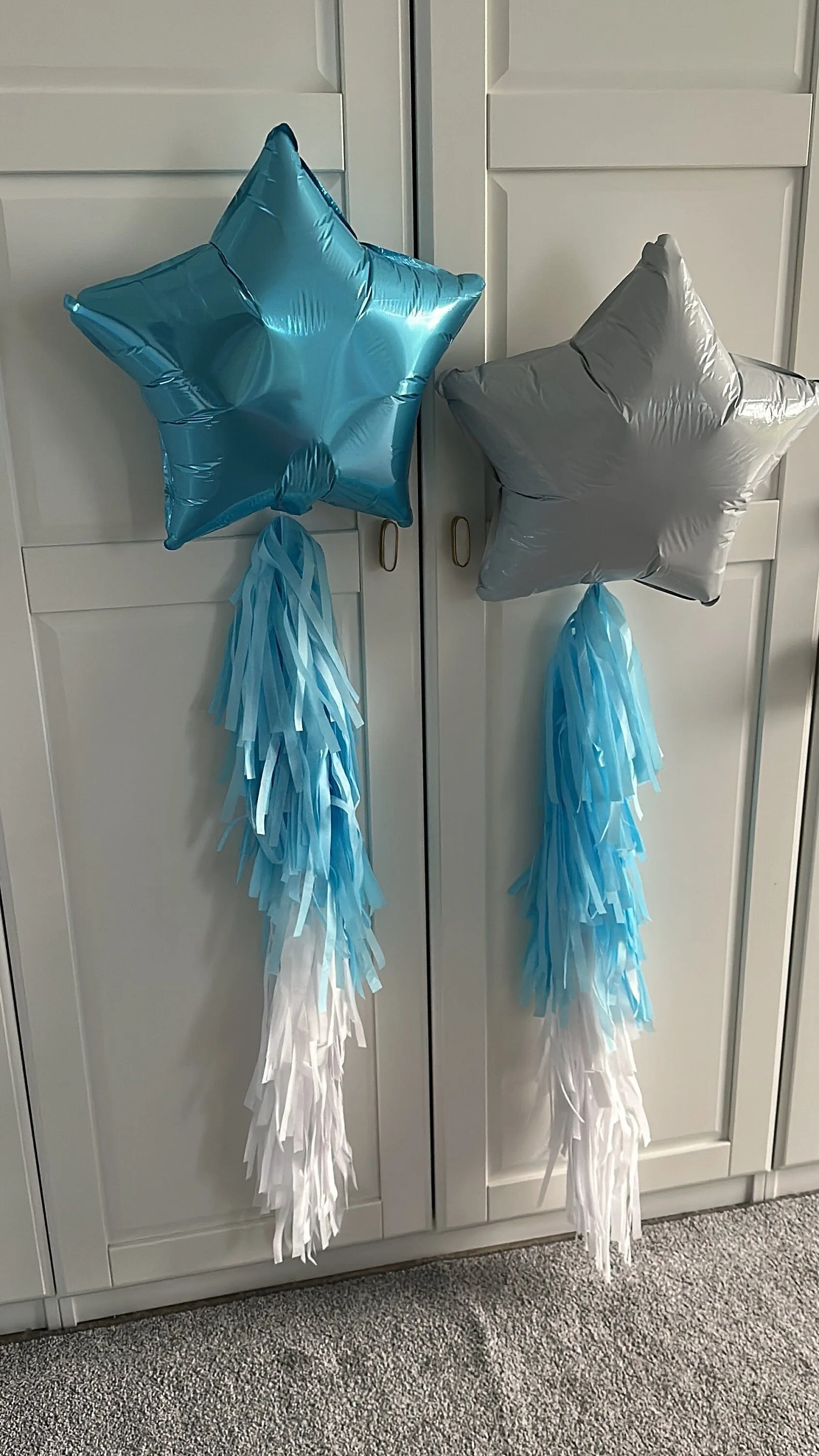 White and blue star shaped balloons with tassel tail ice winter wonderland birthday decorations- fully assembled ready to use